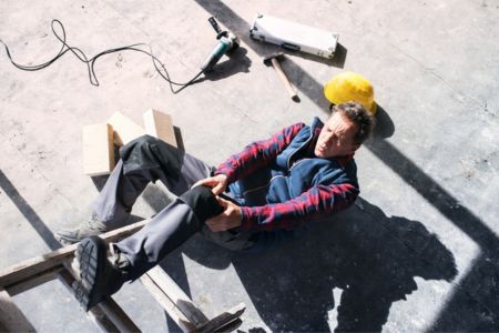 Construction worker unsafe ladder safety mistake
