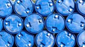 Group of blue barrels used for industrial waste management