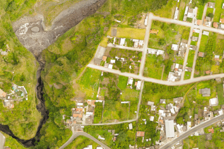 Aerial view of land with buildings on it