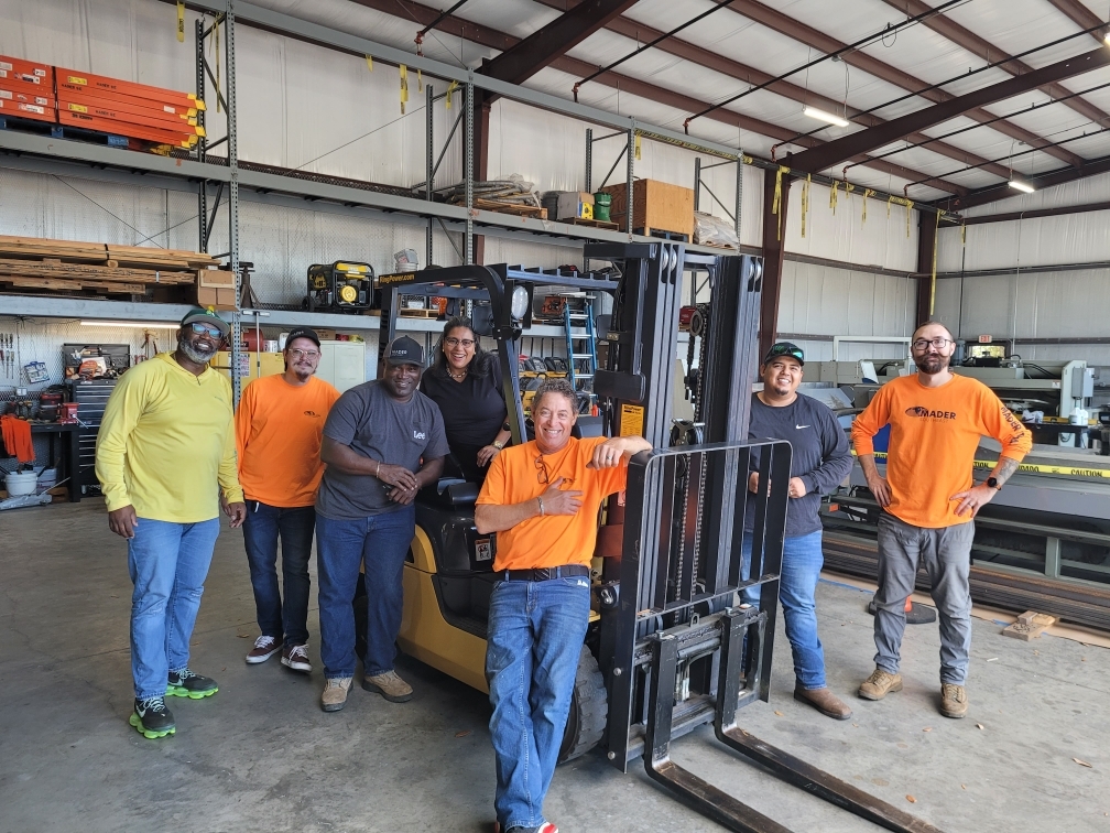 A line of parked forklifts