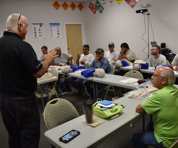 AOTC first aid, CPR, AED training instructor teaching class.