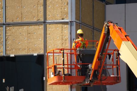 construction worker operating aerial lift