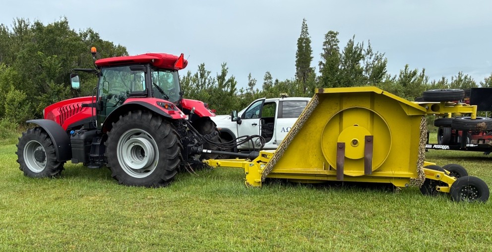 Tractor with mower attachment used for right-of-way vegetation maintenance